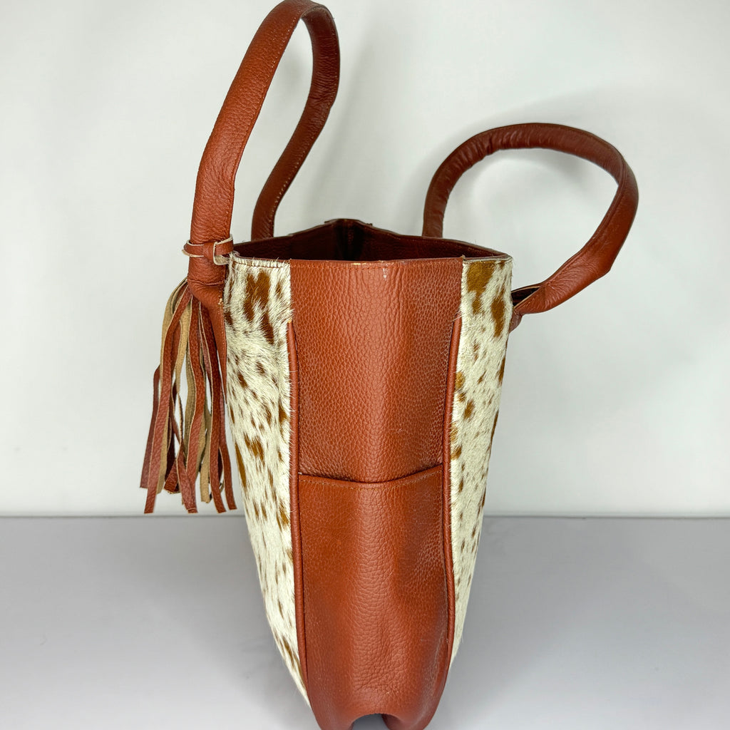 Tan And White Cowhide Leather Tote Bag with Tassel Accent