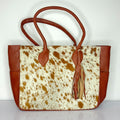 Tan And White Cowhide Leather Tote Bag with Tassel Accent